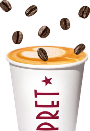 a pret express coffee cup with coffee beans coming out of it